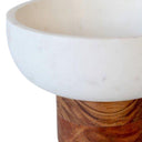 Side profile showing curved marble bowl and elevated wood base
