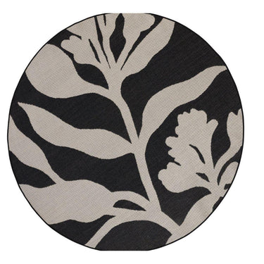 Round rug with black and beige leaf botanical pattern on a white background