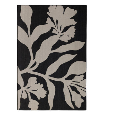 The Wildvine Rug in ebony, a durable polypropylene flatweave rug with a minimalist floral design.