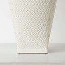 Close-up of sculpted pattern on the off-white ceramic lamp base