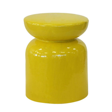 Versatile yellow stool used as a side table