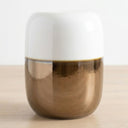 ceramic stool with white and bronze two-tone finish.
