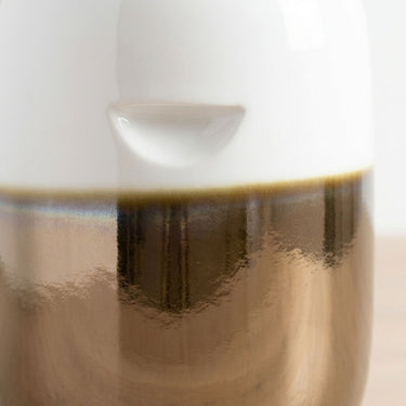 Small ceramic stool subtle handle with white and bronze two-tone finish.