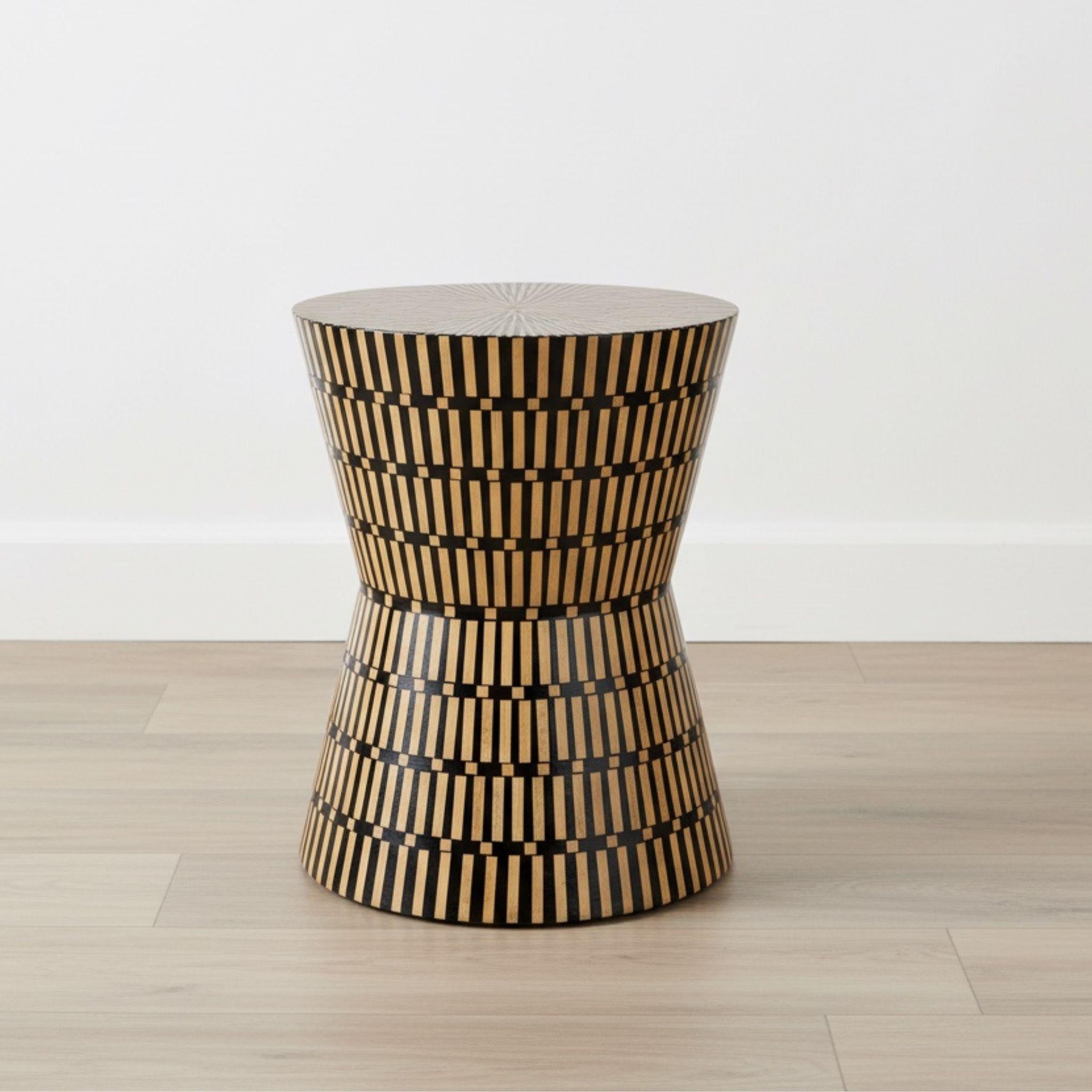Amelia Modern Accent Stool styled as a side table in a contemporary living room studio