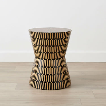 Amelia Modern Accent Stool styled as a side table in a contemporary living room studio