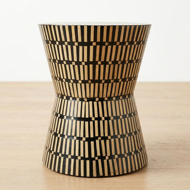 Amelia hourglass bamboo inlay side table with black and natural striped pattern.