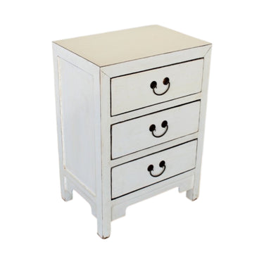 Angled shot of the white Arka Bedside Table showing the lived-in texture of the elmwood finish