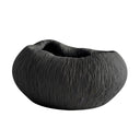 black ribbed bowl with textured surface and rounded organic shape.