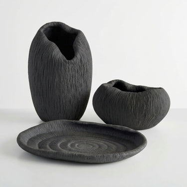 Atoll black ribbed collection with a vase, tray and bowl in deep black with fine ridges
