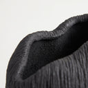 Deep black ribbed vase top rim with fine ridges.