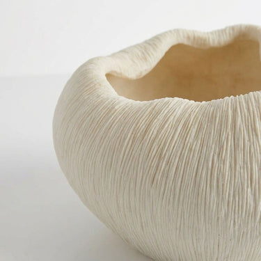 Ribbed decorative bowl rim with a matte white finish and textured surface.