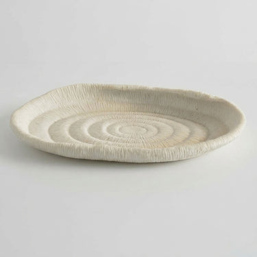 Atoll decorative tray with an off-white matte finish and ribbed, textured surface.