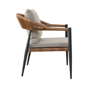 Outdoor armchair with a woven wicker frame, light grey seat and back cushions, angle.