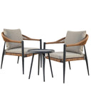 Two outdoor armchairs with woven wicker frames, light beige cushions, and black metal legs, small round black side table.