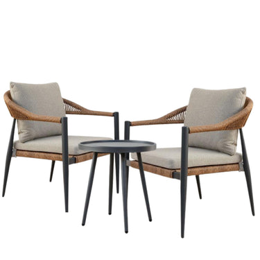 Two outdoor armchairs with woven wicker frames, light beige cushions, and black metal legs, small round black side table.