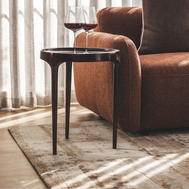 Bali Side Table holding drinks  – functional side table in modern living room design.