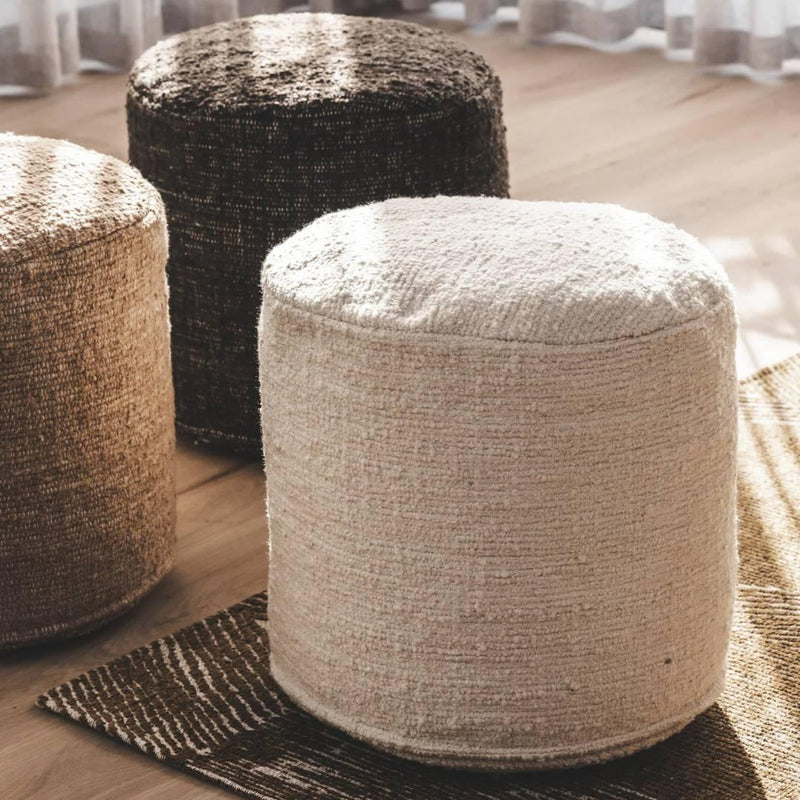 Bayfront outdoor stools in three colourways arranged on a floor, showing their textured design and versatile style