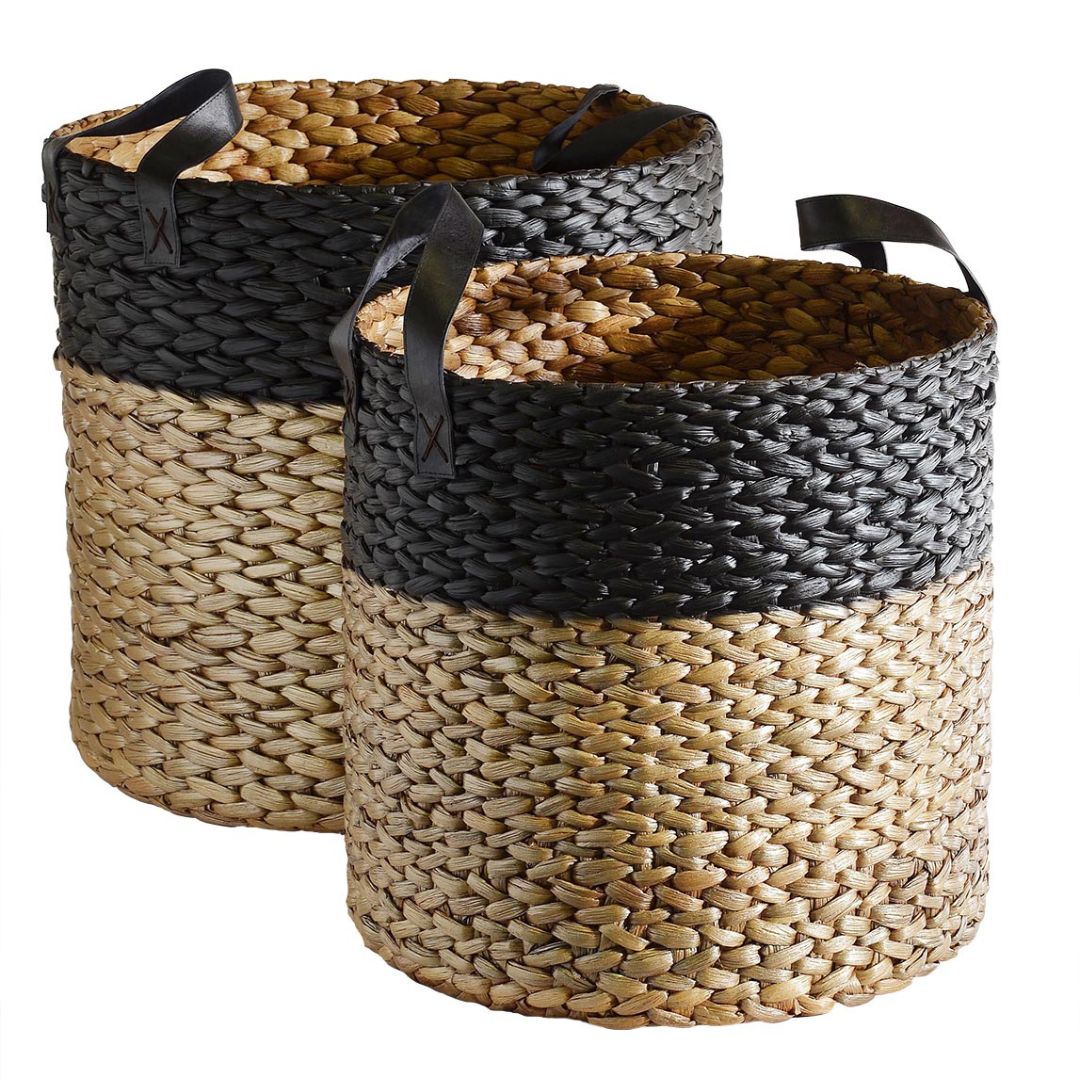 two hyacinth storage baskets with black leather handles