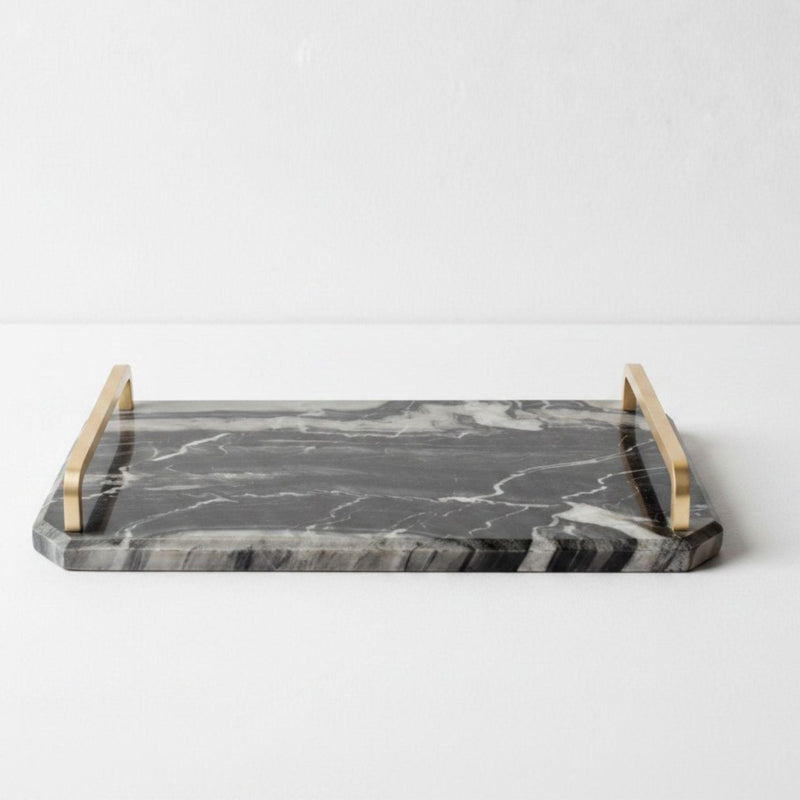 marble tray with gold handles in black and grey veining