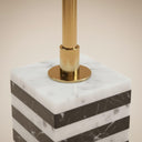 Brass and marble side table base detail in black and white
