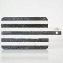 Marble-patterned cutting board with black and white stripes 