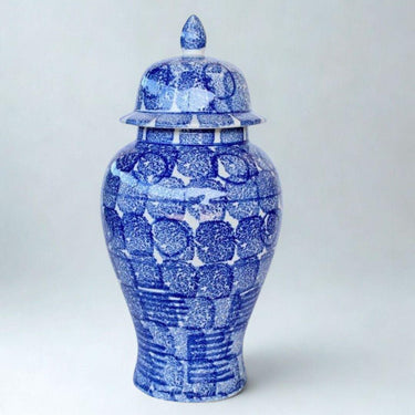 Blue and white ceramic jar  with a lid on 