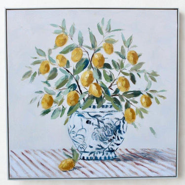 Framed canvas print of blue and white vase and lemon branches with raised detailing
