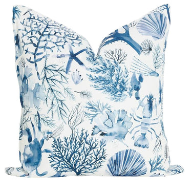 Blue Coast Shells scatter cushion with a blue and white coral and seashell print