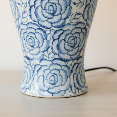 Ceramic lamp base close-up with blue rose design