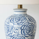 Patterned table lamp detail with antique brass neck