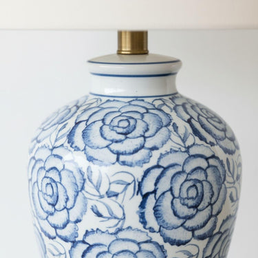 Patterned table lamp detail with antique brass neck