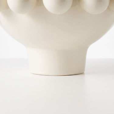 Cream ceramic pedestal bowl base with large decorative bobble accents on rim.