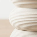 white coiled rattan side table frame.