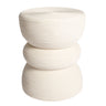 A modern three-tiered rattan side table stool with a stacked, ribbed design in a white colour.