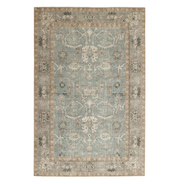 Area rug with a distressed Persian-inspired aesthetic in muted blue and natural desaturated tones