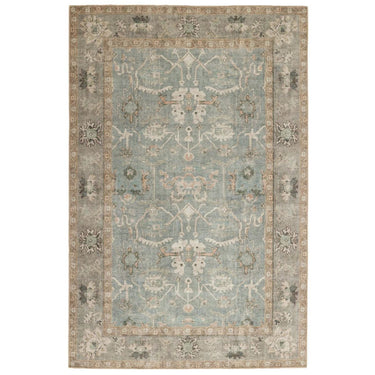 Cathy large area rug with a distressed Persian inspired motif pattern in muted blues, sage green, and warm cream tones.