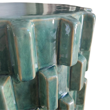 close up of the Handcrafted Celadon Ceramic Side Table with modern sculptural silhouette for indoor and outdoor use