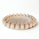 decorative ceramic bowl showing acorn detailing and smooth glaze.