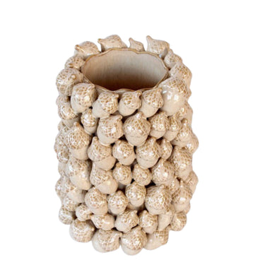 Close-up of the large ceramic vase showing acorn detail and smooth glaze.