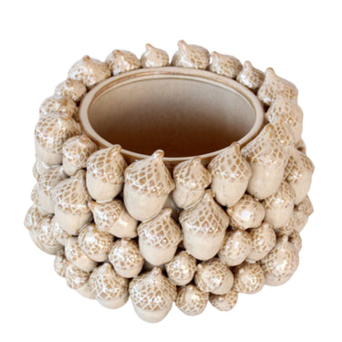 Close-up of the ceramic vase showing acorn detail and smooth glaze.