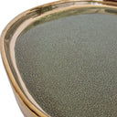 Close-up of ceramic tray showing green glaze and polished gold rim detail