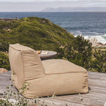 Chapala Occasional Chair styled on patio, modern outdoor furniture, lounge-ready comfort, all-weather upholstered seating