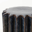 Cobalt Ridge Side Table deep vertical ridges, finished in a reactive glaze blending dark navy blue with metallic bronze tones. 