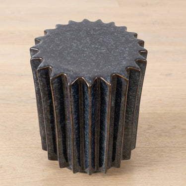 Side Table  with deep vertical ridges, finished in a reactive glaze blending dark navy blue with metallic bronze tones. 
