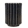round side table with a fluted, ribbed design in dark blue and black textured glaze with bronze-toned metallic accents along the vertical grooves.