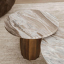 Marble-top side table with wooden base on a beige carpet