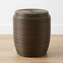 Barrel-shaped coiled rattan side table styled in living room