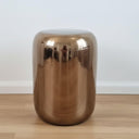 Copper Ceramic Stool styled as a unique ceramic side table in a bright room