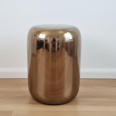 Copper Ceramic Stool styled as a unique ceramic side table in a bright room