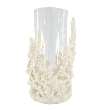 Coastal hurricane candle holder featuring textured coral base and glass cylinder